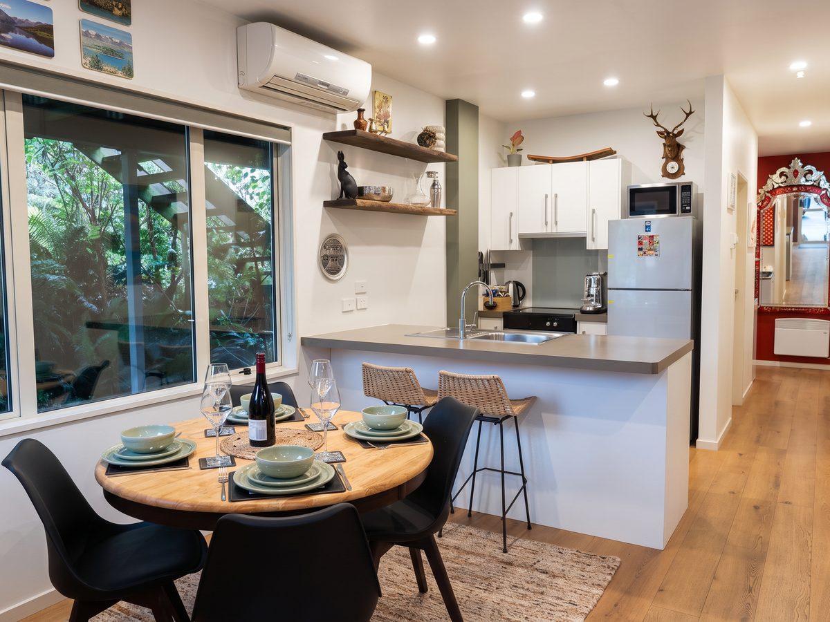 Kitchen and hallway after: styled table setting and tidied surfaces
